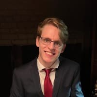 Professional headshot of Tyler Robertson